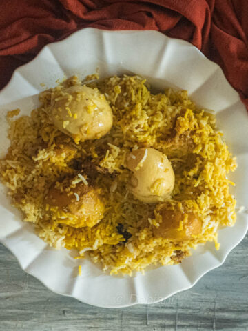 %kolkata-style egg biryani with aloo recipe debjanir rannaghar