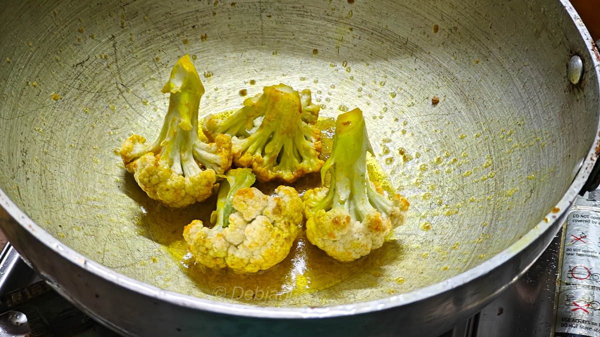Niramish Khichuri Cooking process step 12 - frying marinated cauliflower