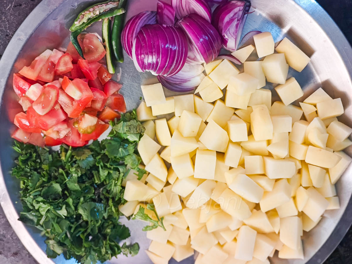 %chopping vegetables for jeera aloo cooking in microwave