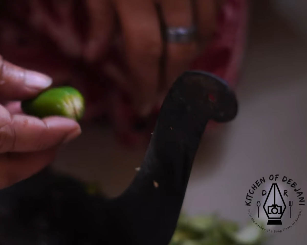 %cutting green chili for toker dal